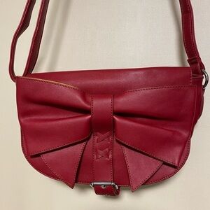 B. Lush Red Purse With Front Bow Detail